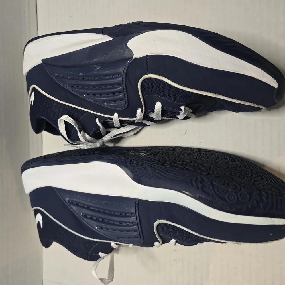 Nike Blue and White Athletic Shoes with‎ Streamlined Design